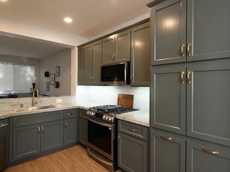 Kitchen remodel with gray cabinetry and updated surfaces