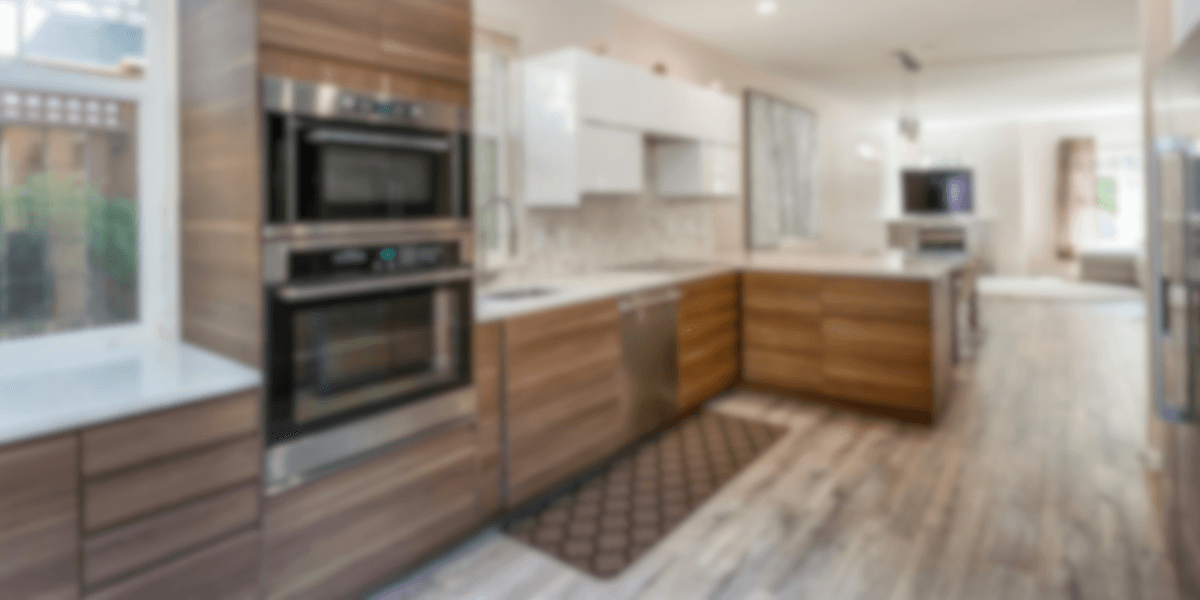 Remodeled kitchen with wood cabinetry and stainless appliances