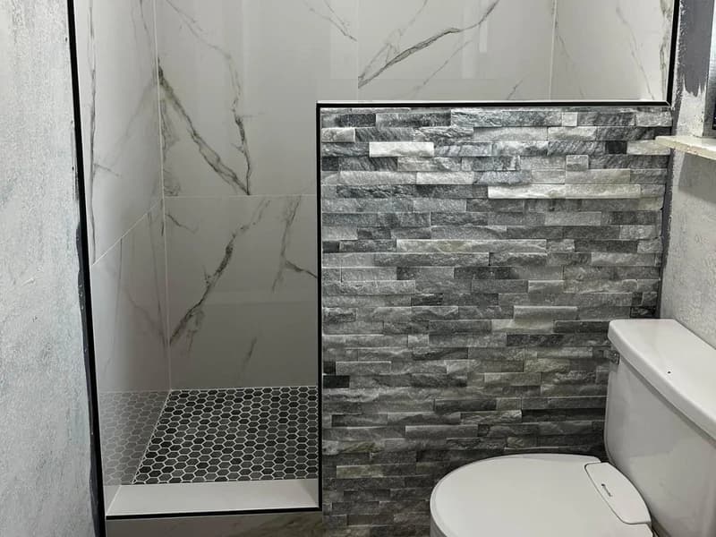 Modern bathroom remodel with clean tile and updated finishes